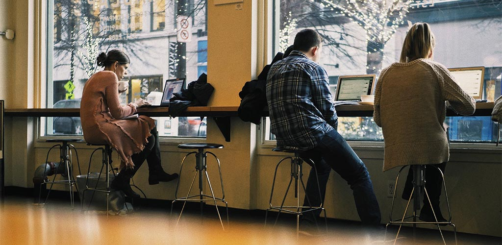 Two single older women working at a coffee shop