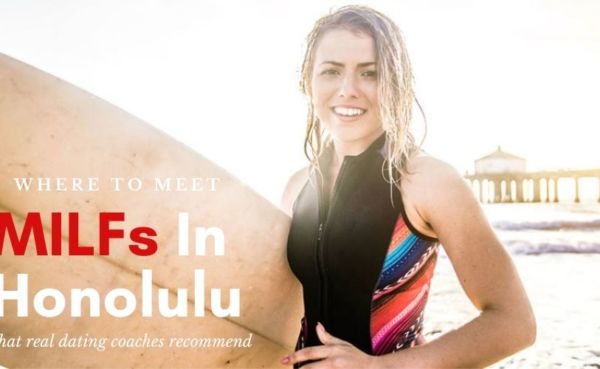 A Honolulu MILF with her surfing board on the beach in Hawaii