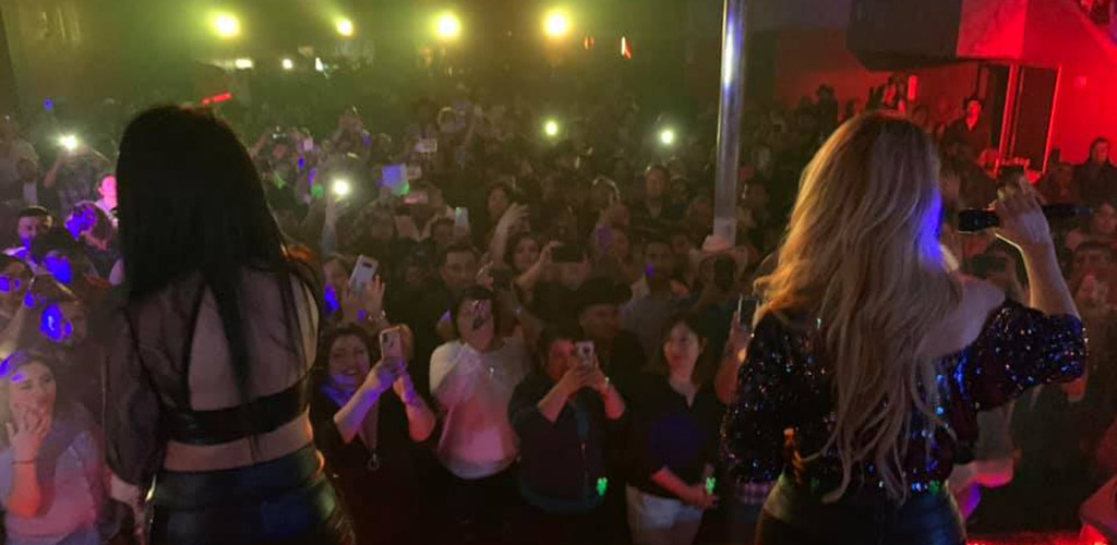 The lively crowd watching dancers at Rubies’ Night Club