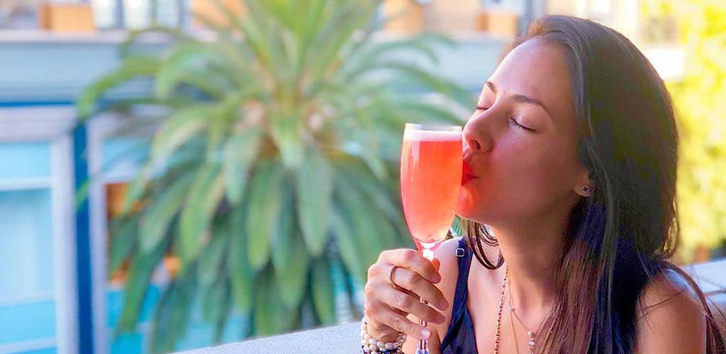 A woman enjoying her drink at VBar