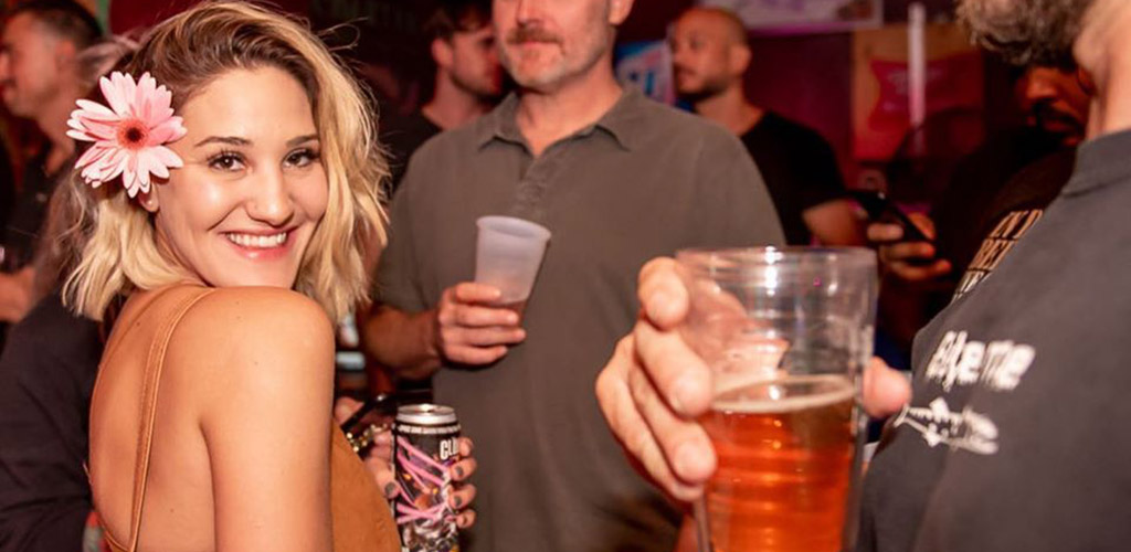 A beautiful woman with a flower in her hair at Barracuda Bar