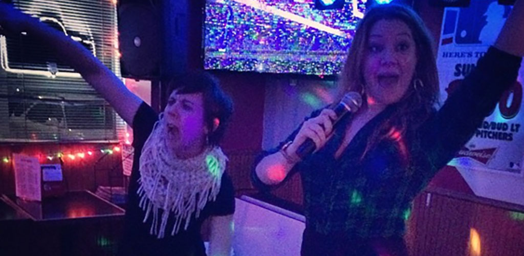 Ladies singing karaoke at Bob’s MVP Lounge