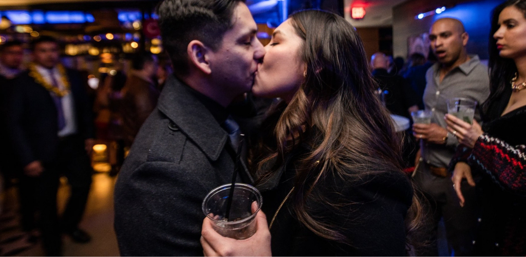 El Paso MILF holding a drink and kissing her date at Circa 1963