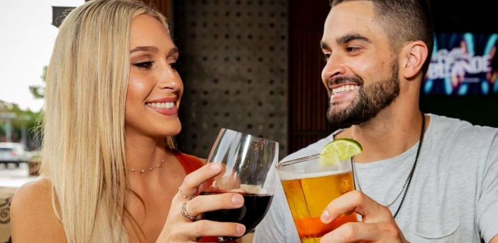 A Mesa MILF toasting drinks with her date at Bottled Blonde