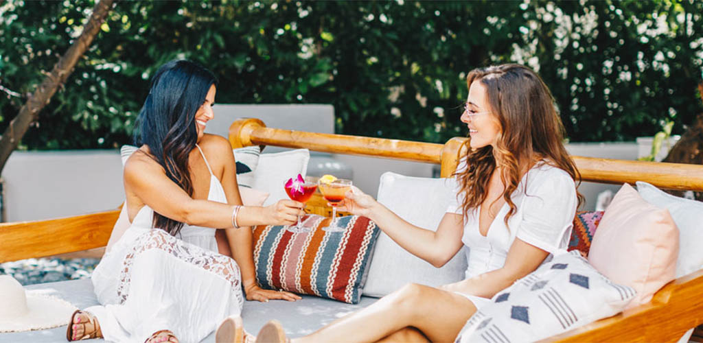 Ladies unwinding in the tropical patio of Skybar