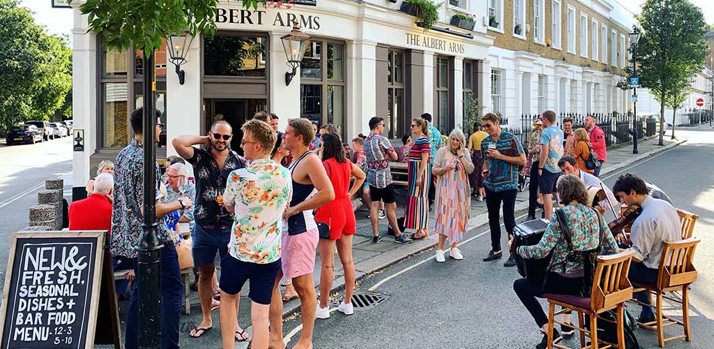 Patrons hanging out outside Albert Arms Pub