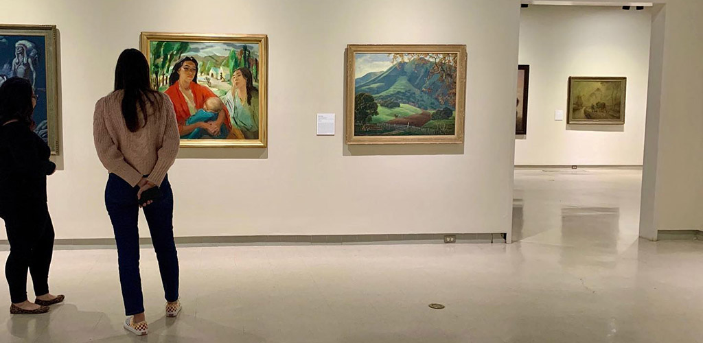 Women viewing artworks at the Fresno Art Museum