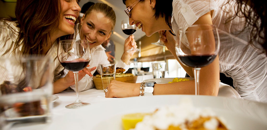 Friends enjoying some wine at Portland City Grill