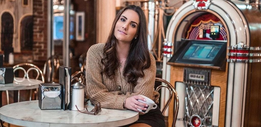 A Boston MILF enjoying a cup of coffee at Vittoria Caffe