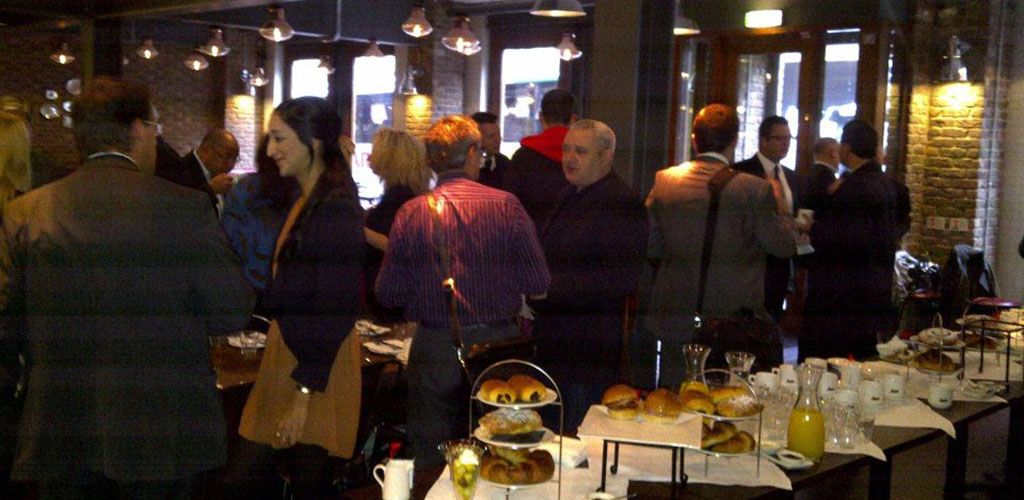 People gathered around the buffet table at Hanover Street Social