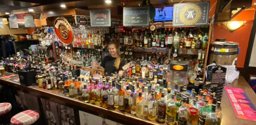 The fully stocked bar at The Keys