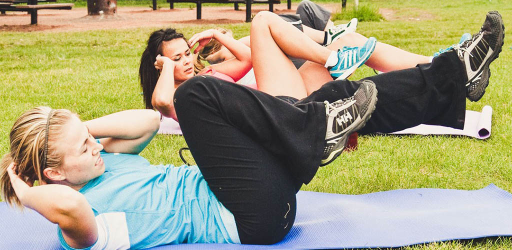 Women working out outdoors at Edmonton Sports and Social Club