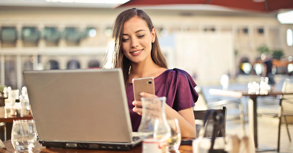 Woman smiling at her texts