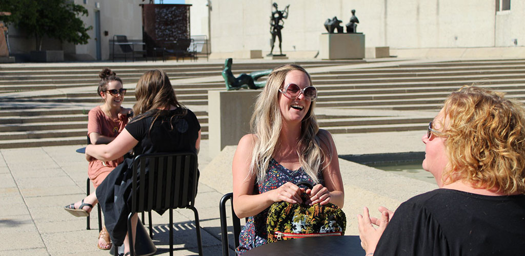 Cougars in Winnipeg sitting in the sun outside Winnipeg Art Gallery