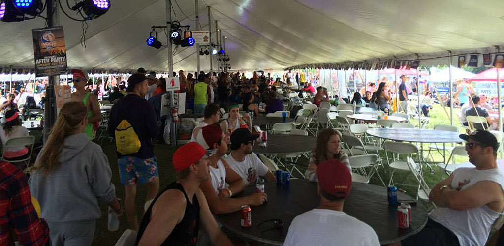 Friends drinking in a tent at Winnipeg Rec League