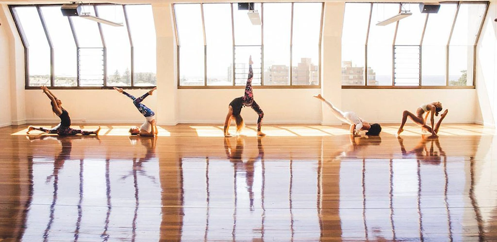 A class at the brightly lit Yoga Loft