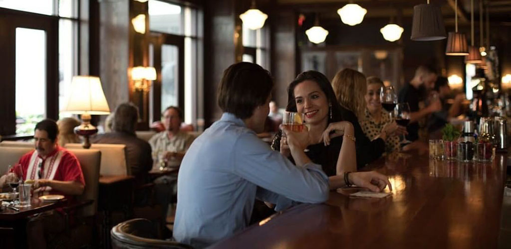 A woman engaged in a fascinating conversation at Bohanan's