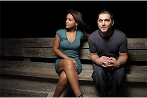 socially awkward man sitting besides woman