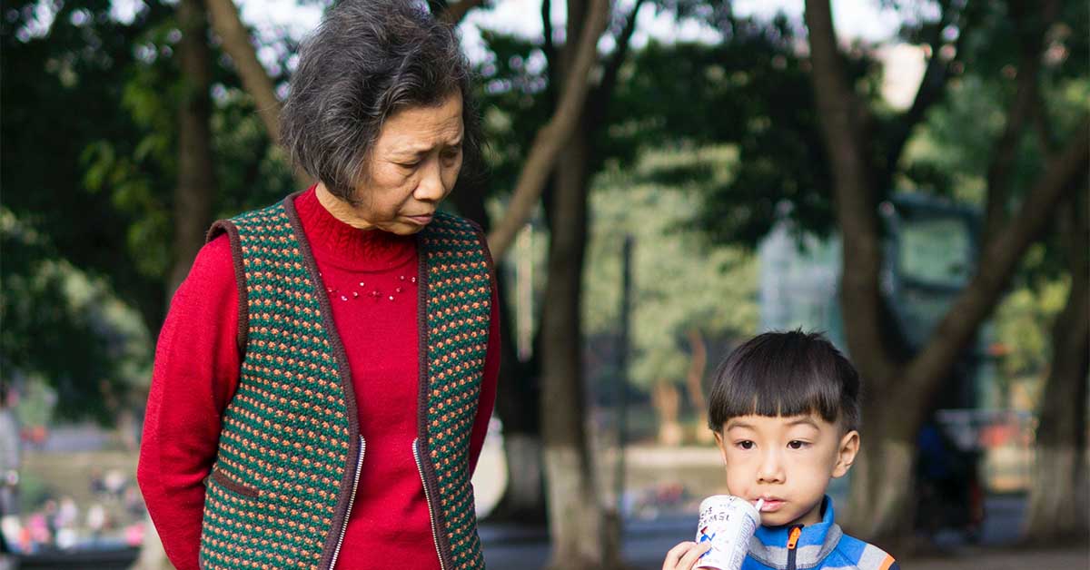 Woman staring at a younger boy