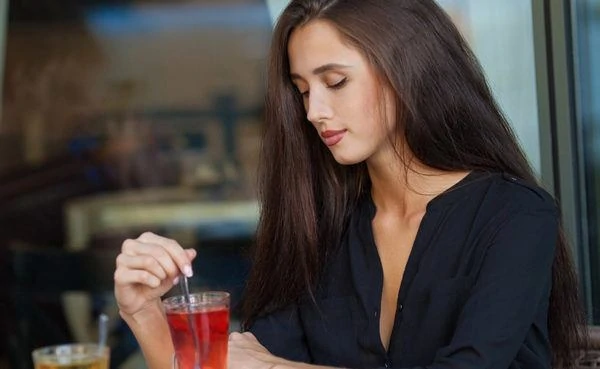 A hot cougar in North Carolina drinking tea in a cafe