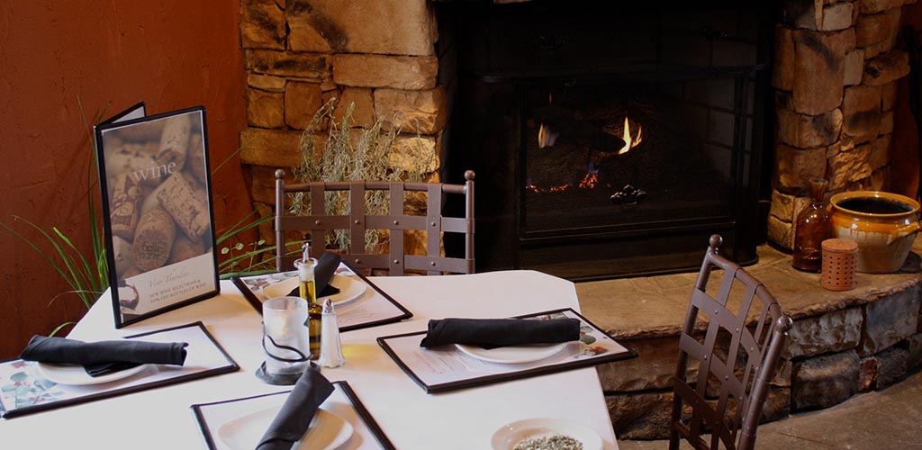 A cozy seat by the fireplace at Bella Notte