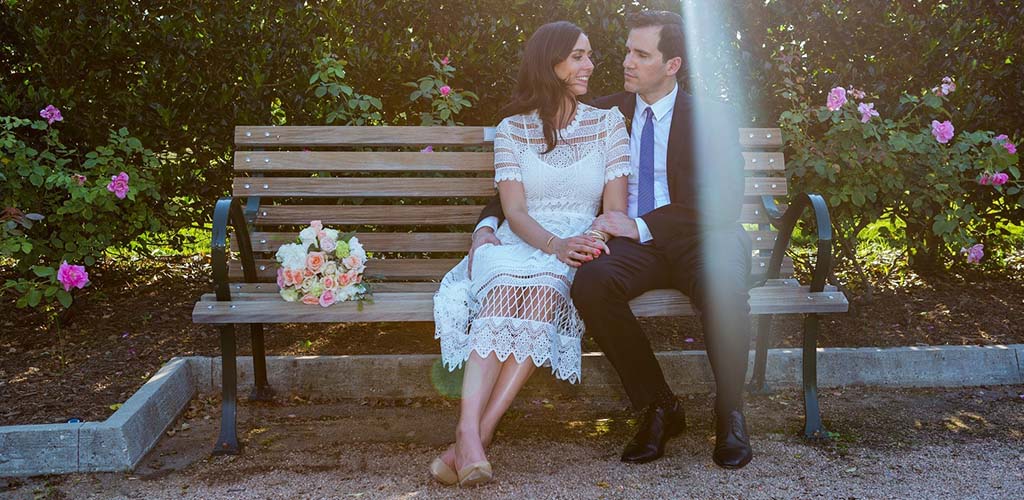 A couple on a bench at Hermann Park Conservancy