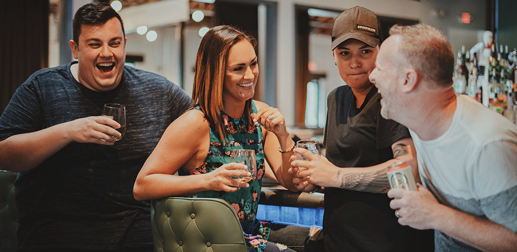 A woman meeting new people at Queen Park Social