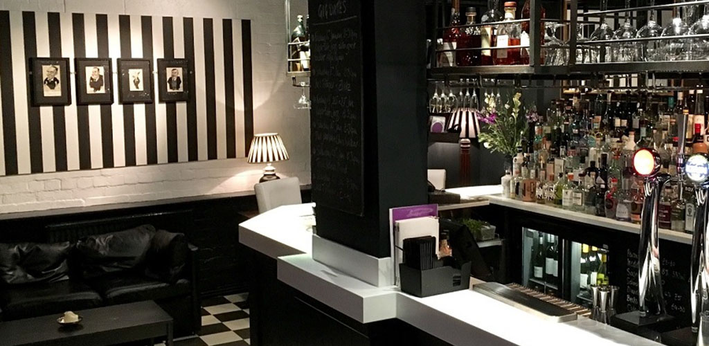 The classy black and white bar at Trippets Bar