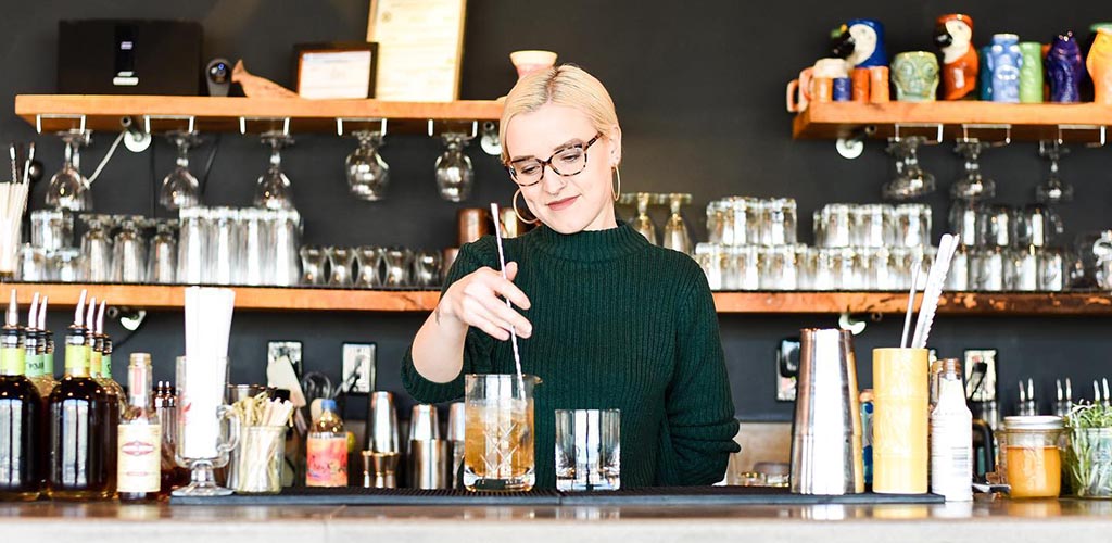 The beautiful bartender mixing drinks at Cardinal Spirits