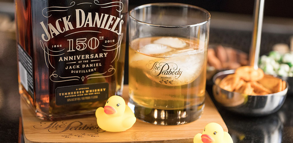 A glass of whiskey with cute rubber duckies at the Lobby Bar at Peabody's