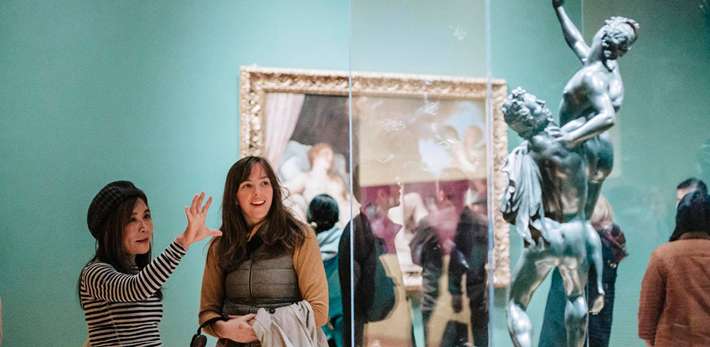 Cultured cougars in Washington admiring a sculpture in the Seattle Art Museum