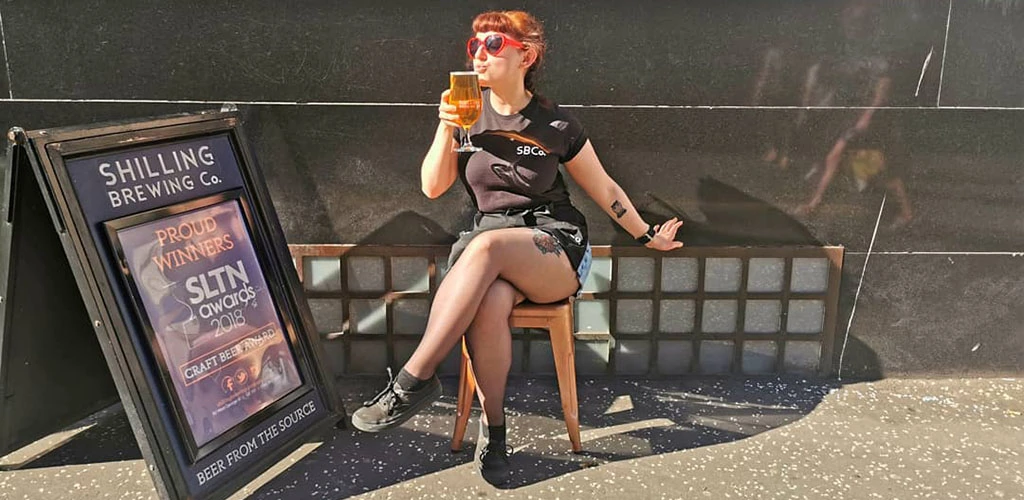 A hot older woman outside Shilling Brewing