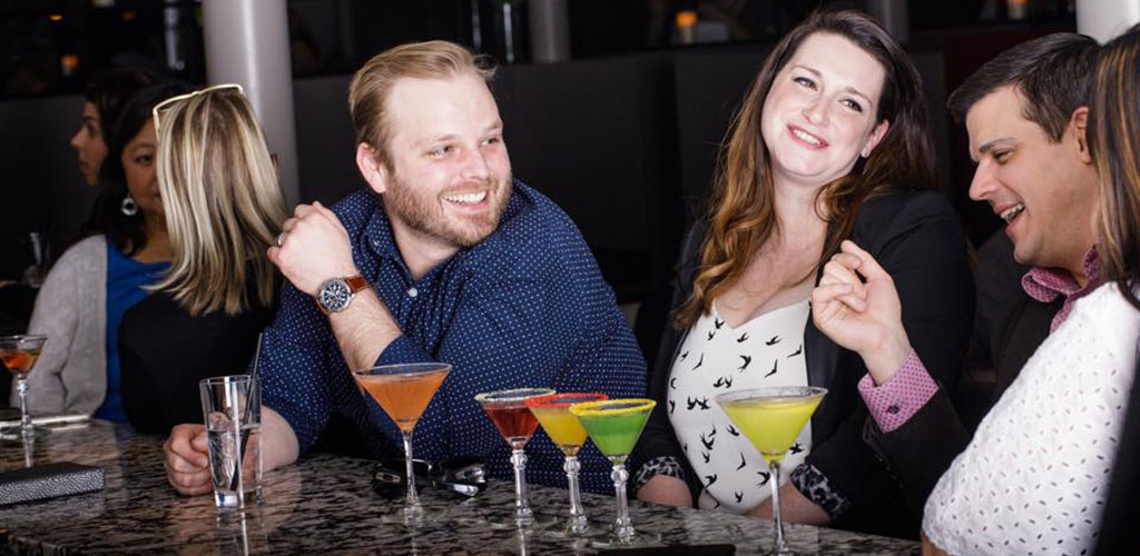 Men and women enjoying cocktails from Venetian Moon