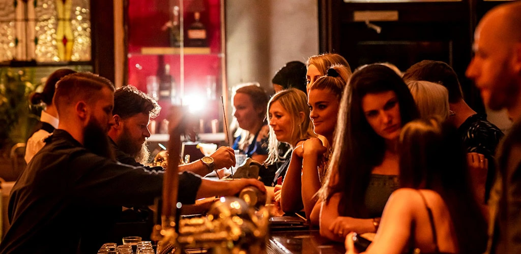 The bar area full of women at The Press Club