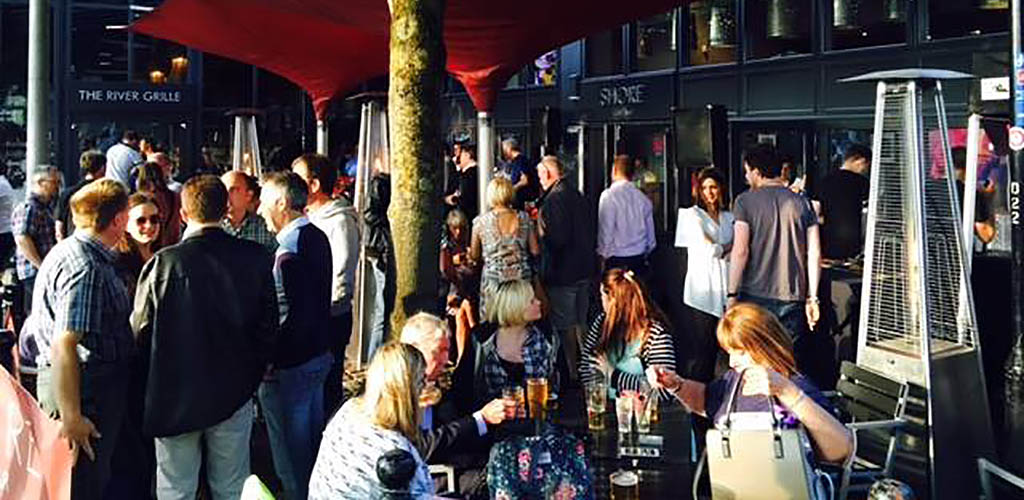 Lots of people in the outdoor area of The Shore Cafe