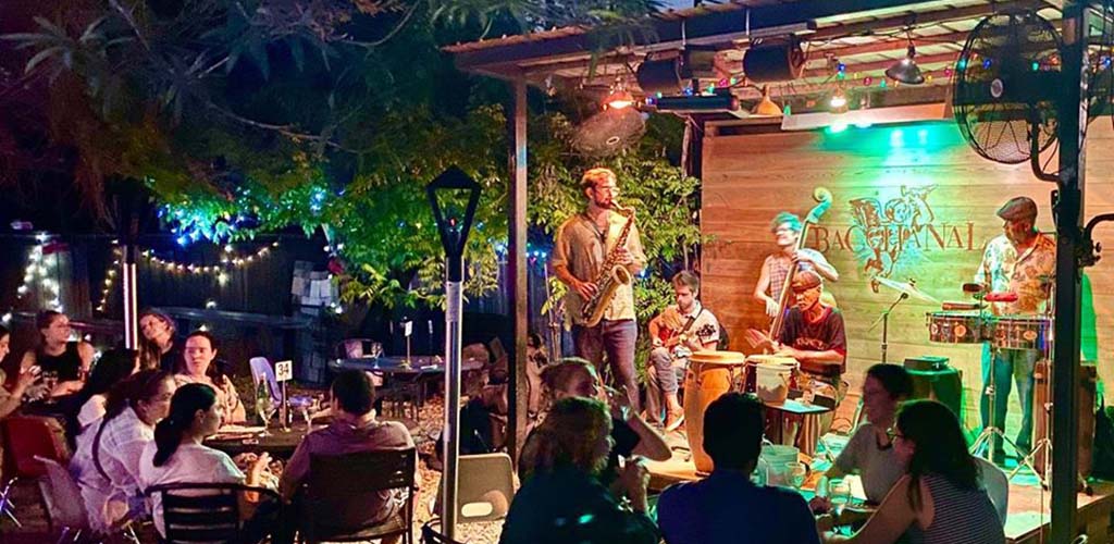 An outdoor acoustic performance at Bacchanal