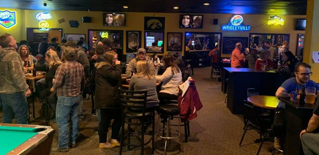 A crowd of people at bar Tailgators Social Club