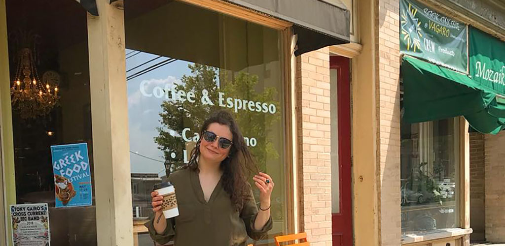 A beautiful woman enjoying her coffee from The Wise Bean