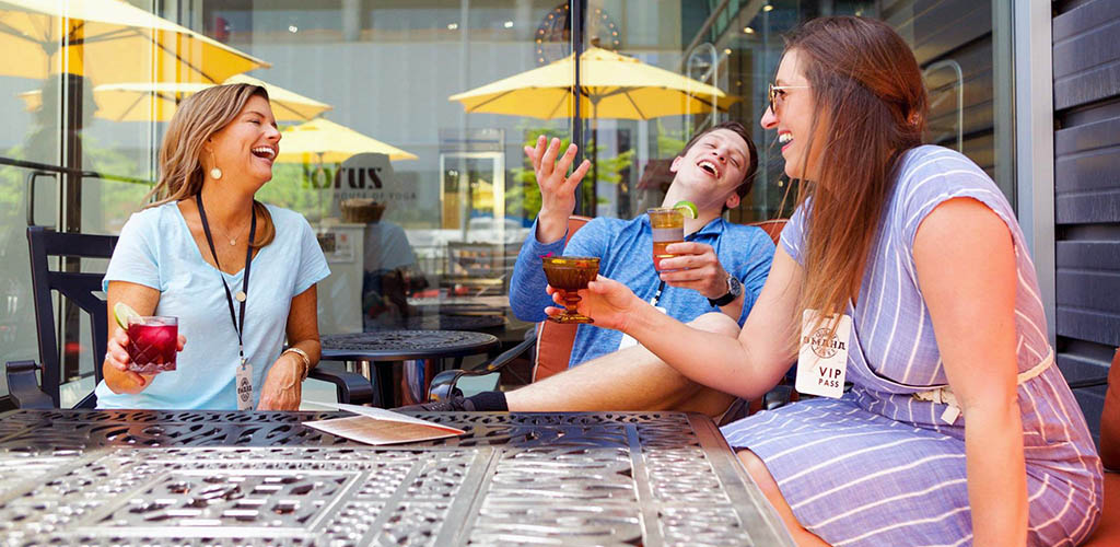 Gorgeous women having drinks at one of the stops in the Omaha Culinary Tours