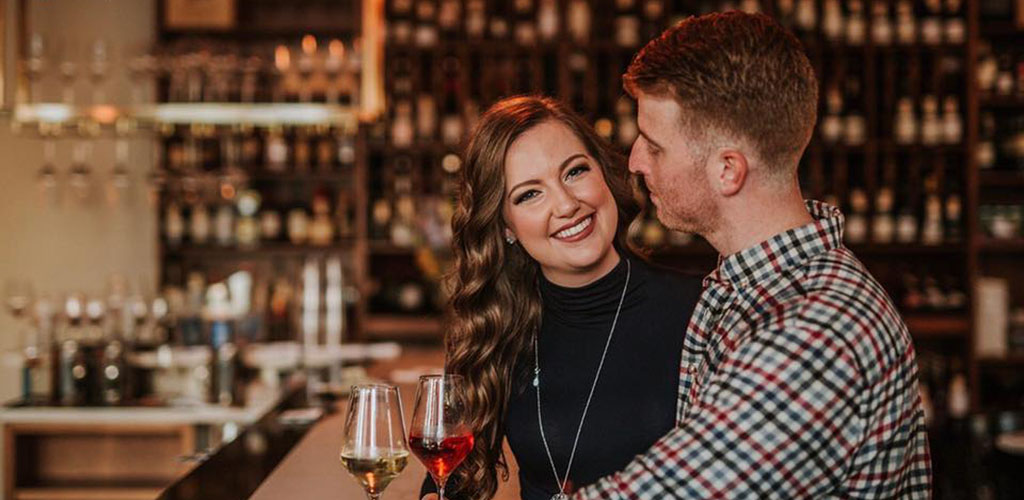 A beautiful woman on a date with a man at Nouvelle Bar & Bottle