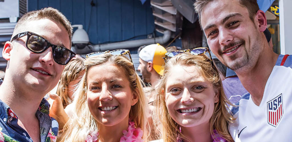 Two couples enjoying a summer event at The Starboard