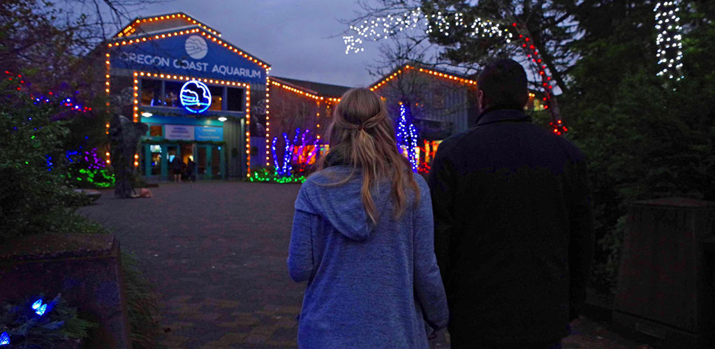 A couple on an evening date at the Oregon Coast Aquarium