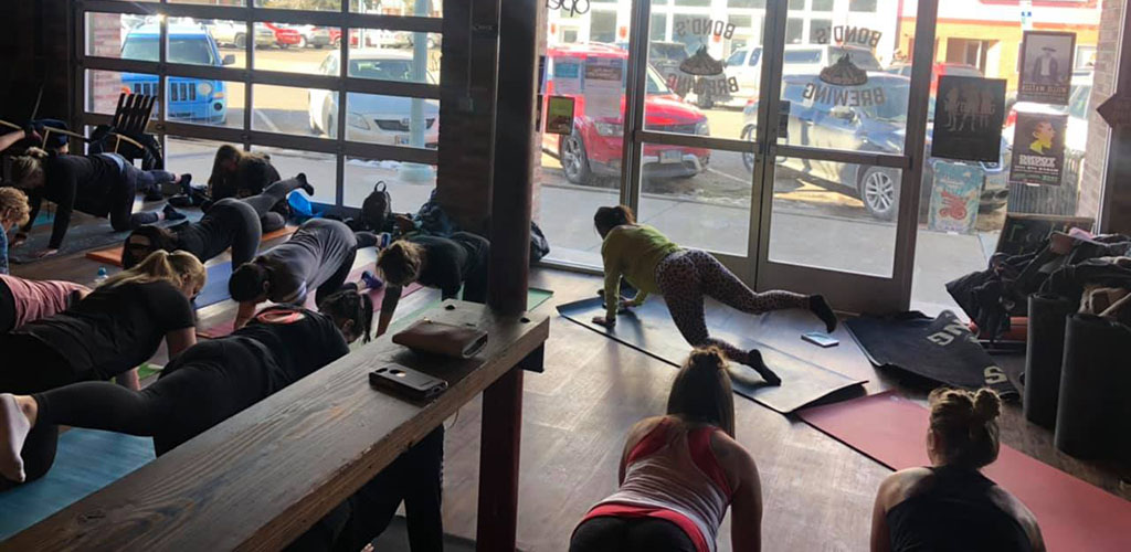 A yogini leading the yoga class at Blossom Yoga