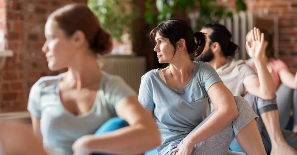 Sexy mature woman at a yoga class