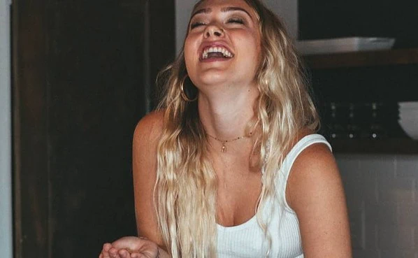 Attractive girl laughing hard