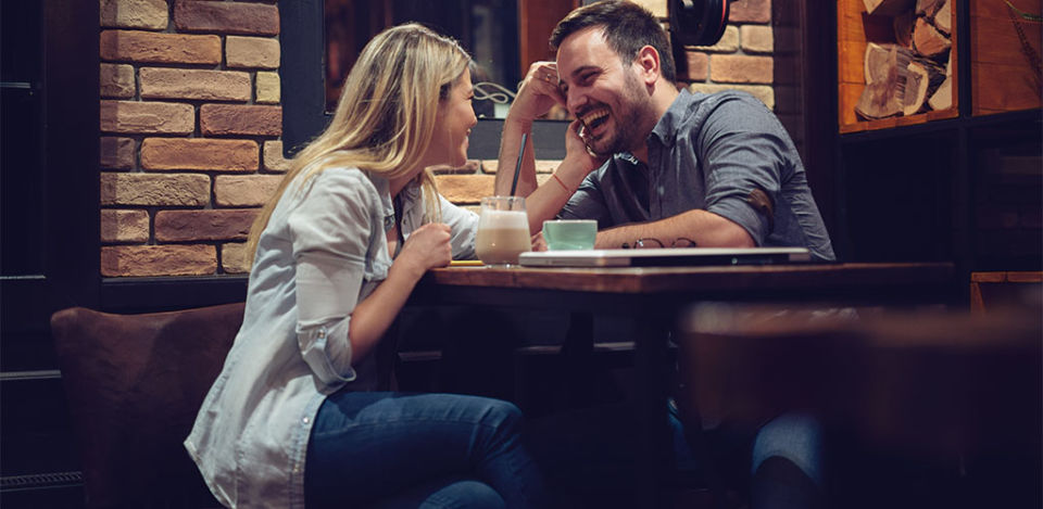 man and woman laughing