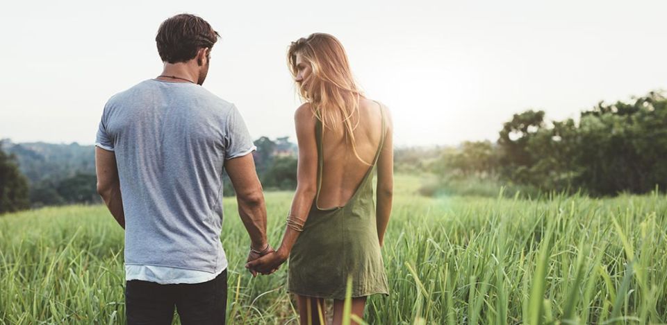 Man walking with a woman and winning her back after hurting her