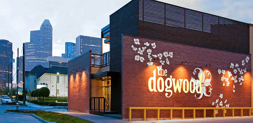 The Dogwood bar with its flower mural over brick exterior