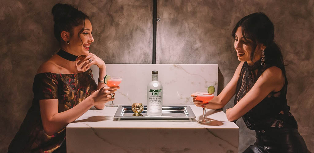 Two women enjoying drinks at Melrose Station