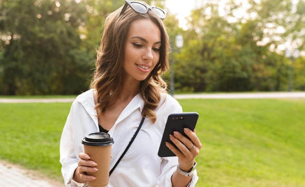 Pretty young woman spending time at the park